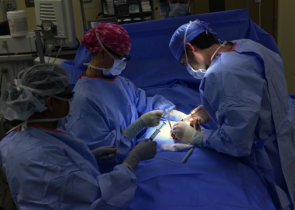 doctors performing surgery